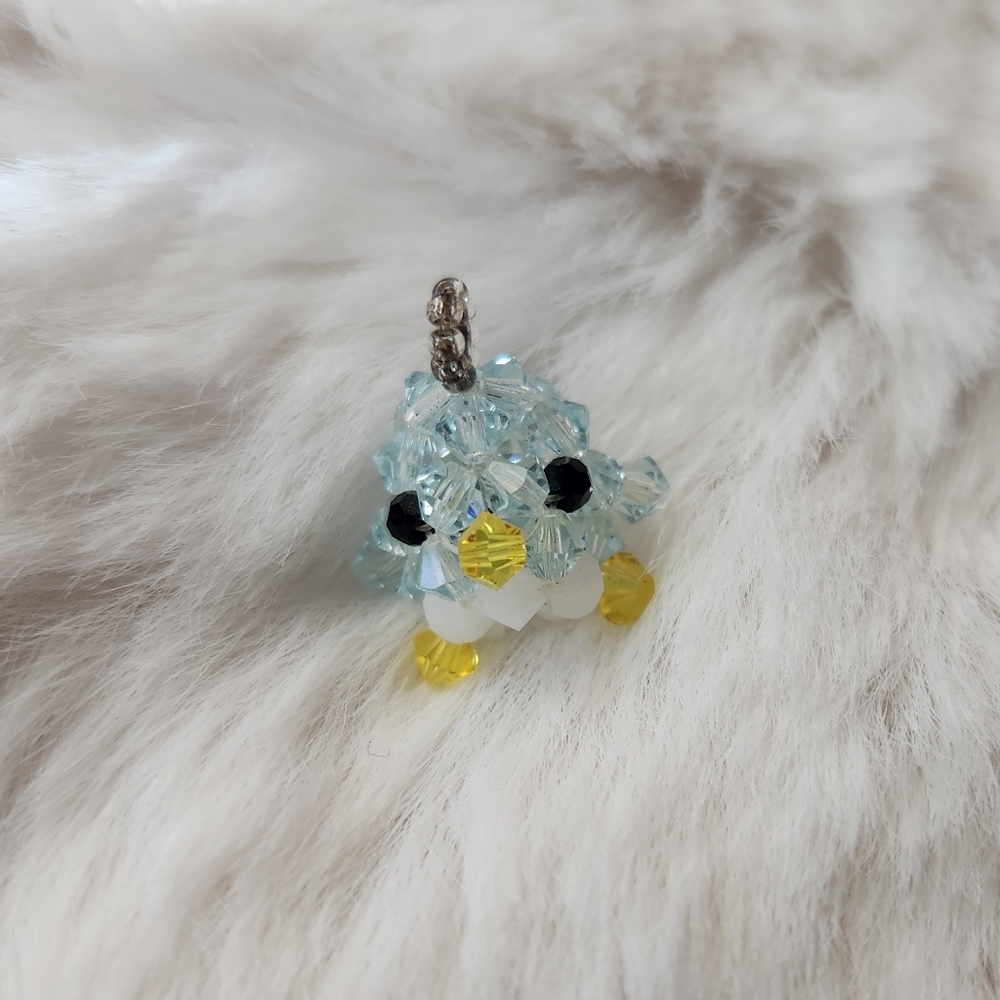 Handmade blue and yellow beaded bird charm